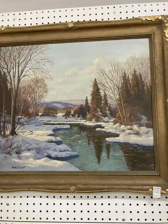 Naka-frame na tanawin ng ilog ng taglamig na ipinapakita sa Southworks Antiques sa Cambridge