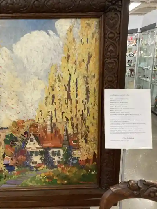 Naka-frame na cottage landscape painting na ipinapakita sa Southworks Antiques sa Cambridge