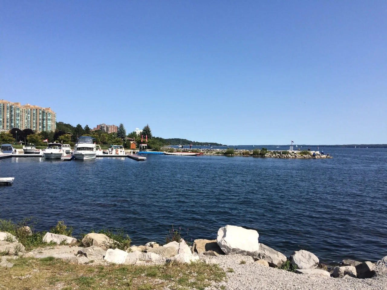 Barrie marina and Lake Simcoe waterfront with boats and condos in the distance