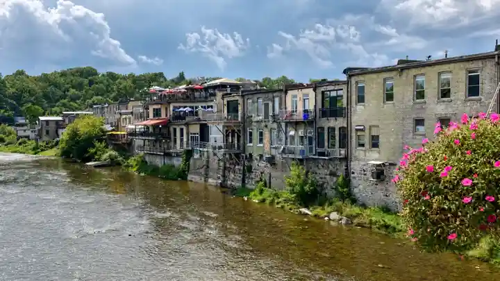 Stone and brick buildings beside the Grand River in downtown Paris, Ontario